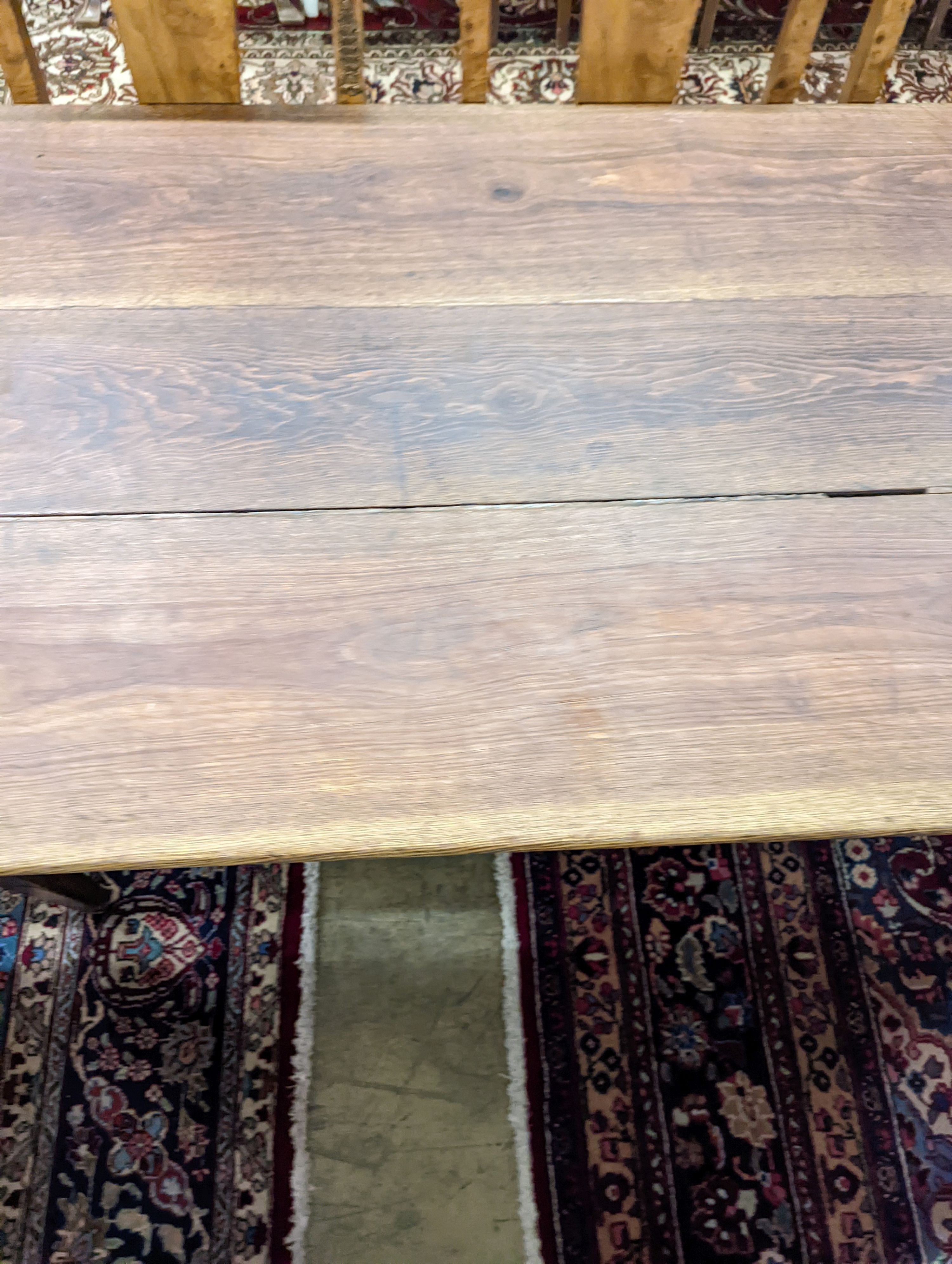 A 19th century French rectangular oak kitchen table. W-153cm, D-75cm, H-73cm.